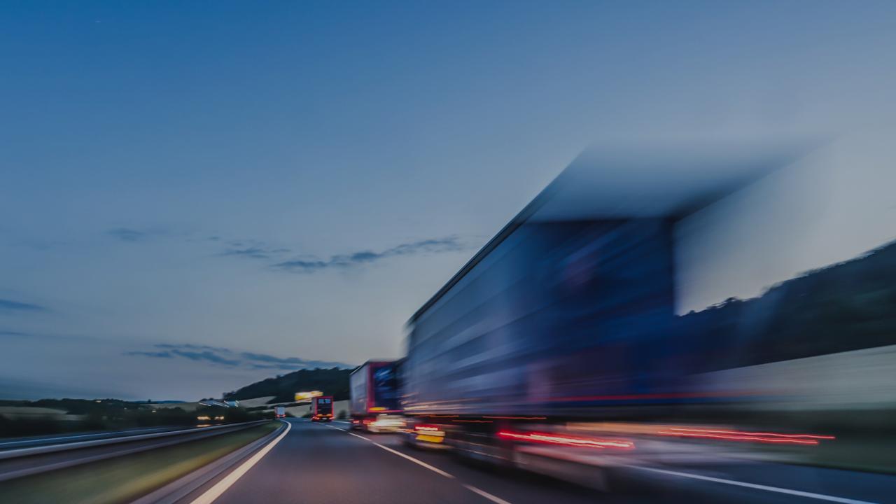 Long exposure photo of semi-trucks on highway